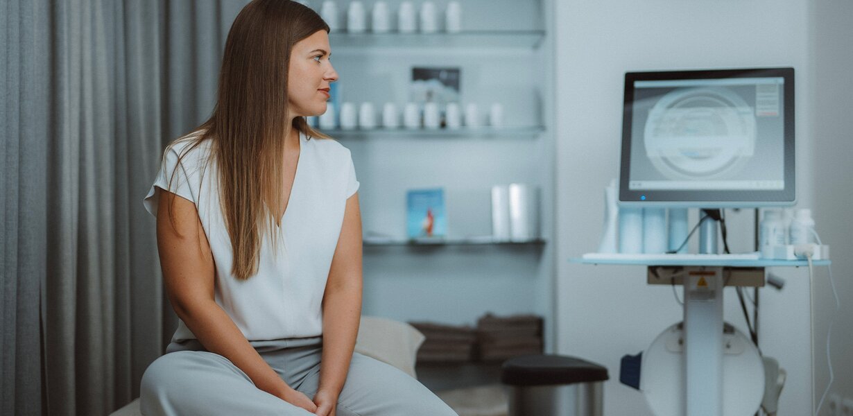 Woman during bone density measurement